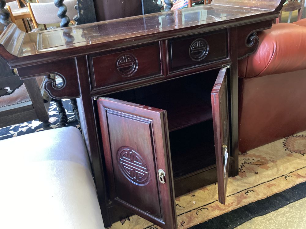 A Chinese carved hardwood side cabinet, width 95cm, depth 41cm, height 81cm